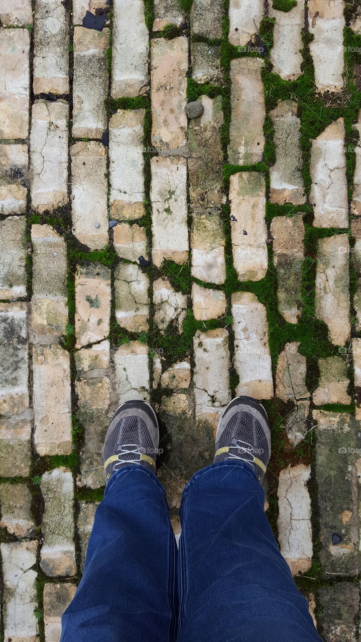 Weathered old brick road can make for an interesting commute in the city.