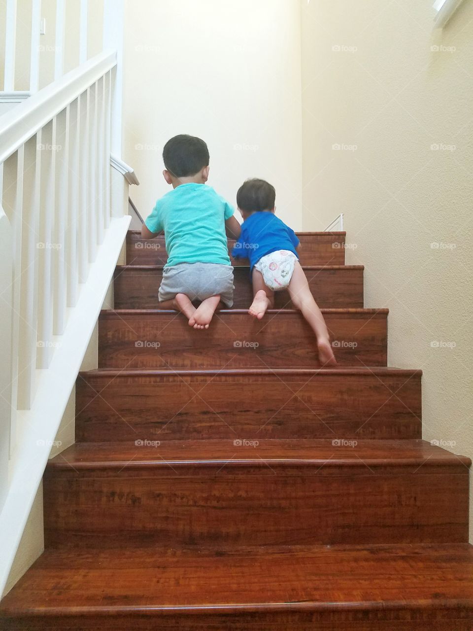 brothers climbing up stairs