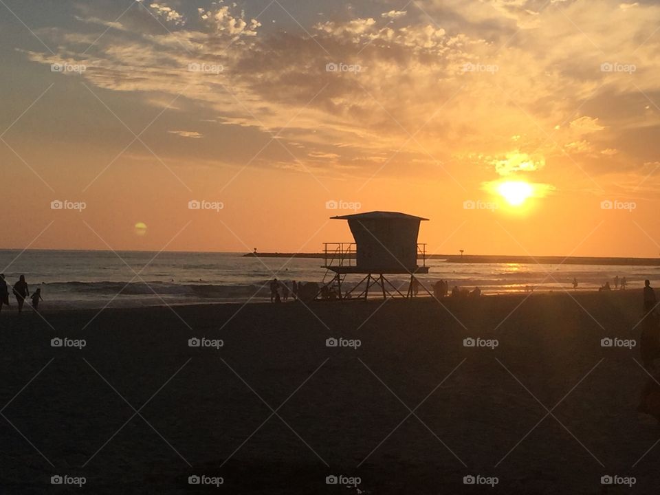 The sun setting at a beach in California