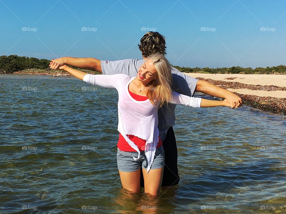 Couple posing in lake