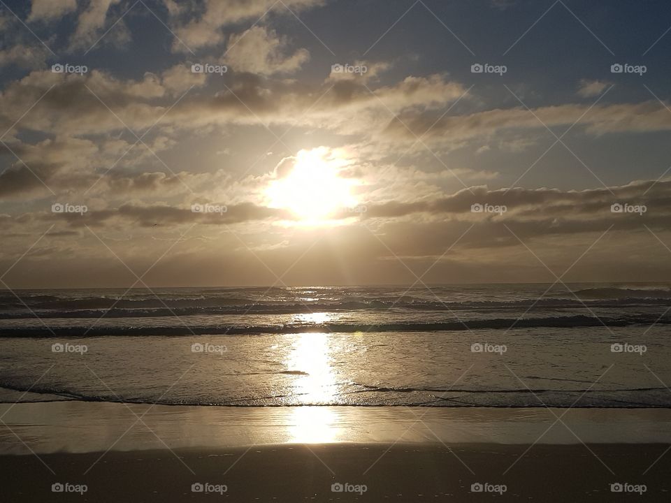 sunrise reflections over the ocean