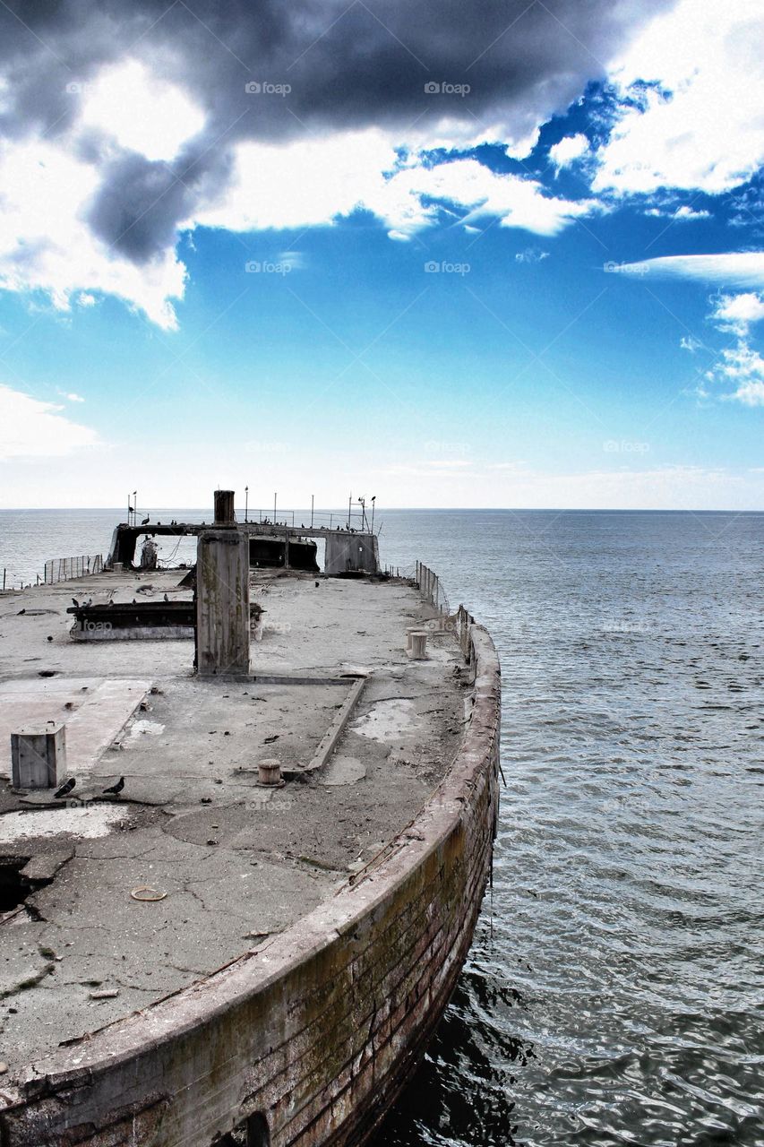 USS Palo Alto also known as the Cement Ship, built out of cement during WWII to experiment with building materials other than steel, it is docked in Aptos California where it eventually broke in half from the surf