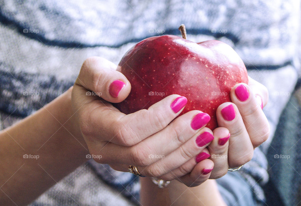 Woman hand holding apple