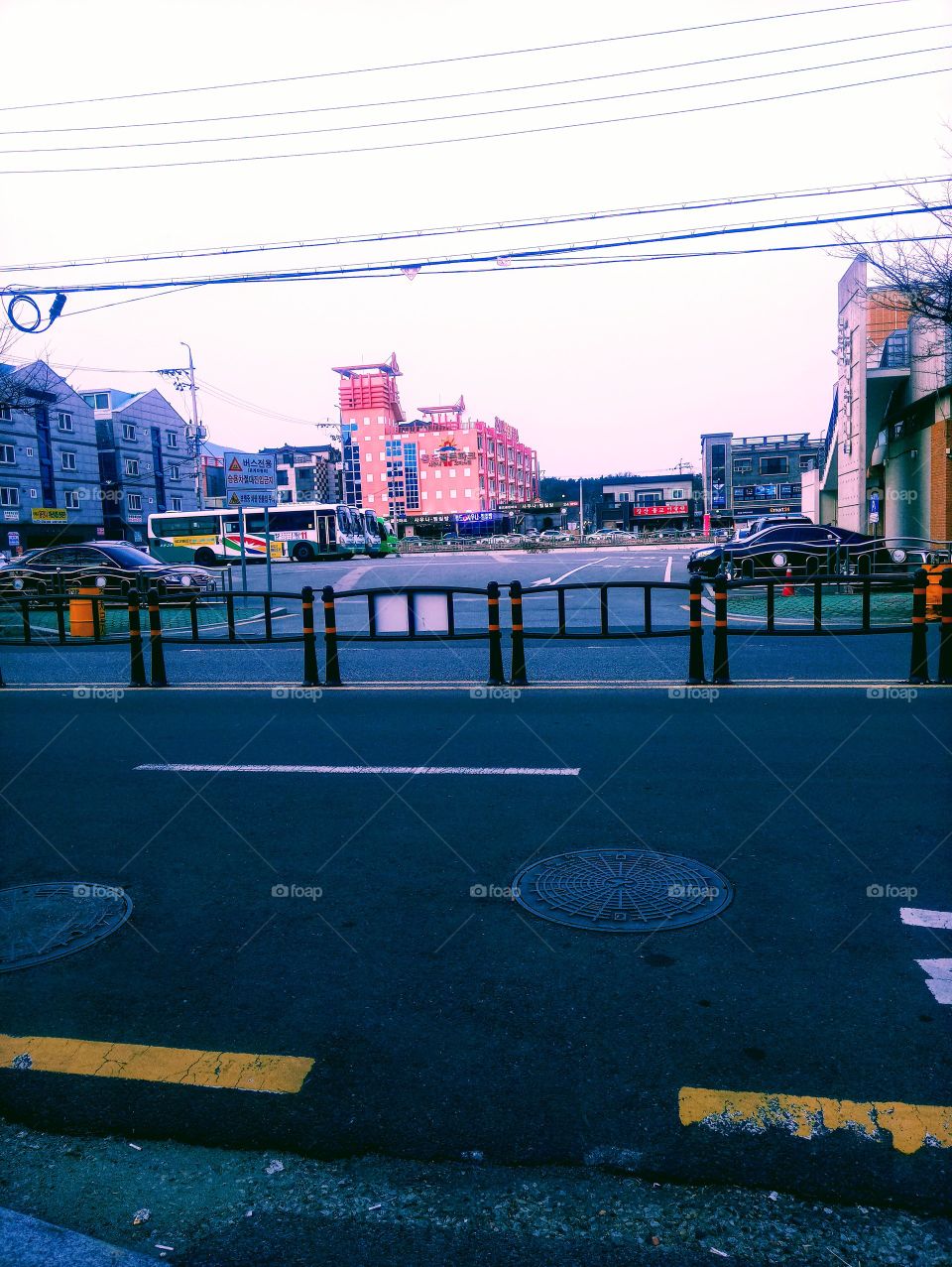 The Tongdosa Terminal In South Korea.
The  pink big building is called "Sauna" A shower place for hot and cold water and for those who want to stay in the hot room. 
The Big space in front of the road is the Terminal where buses are park.