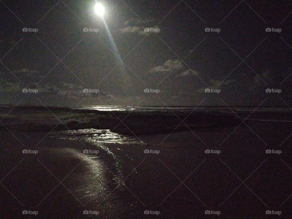 beautiful view of the full moon, having the sea to brighten up