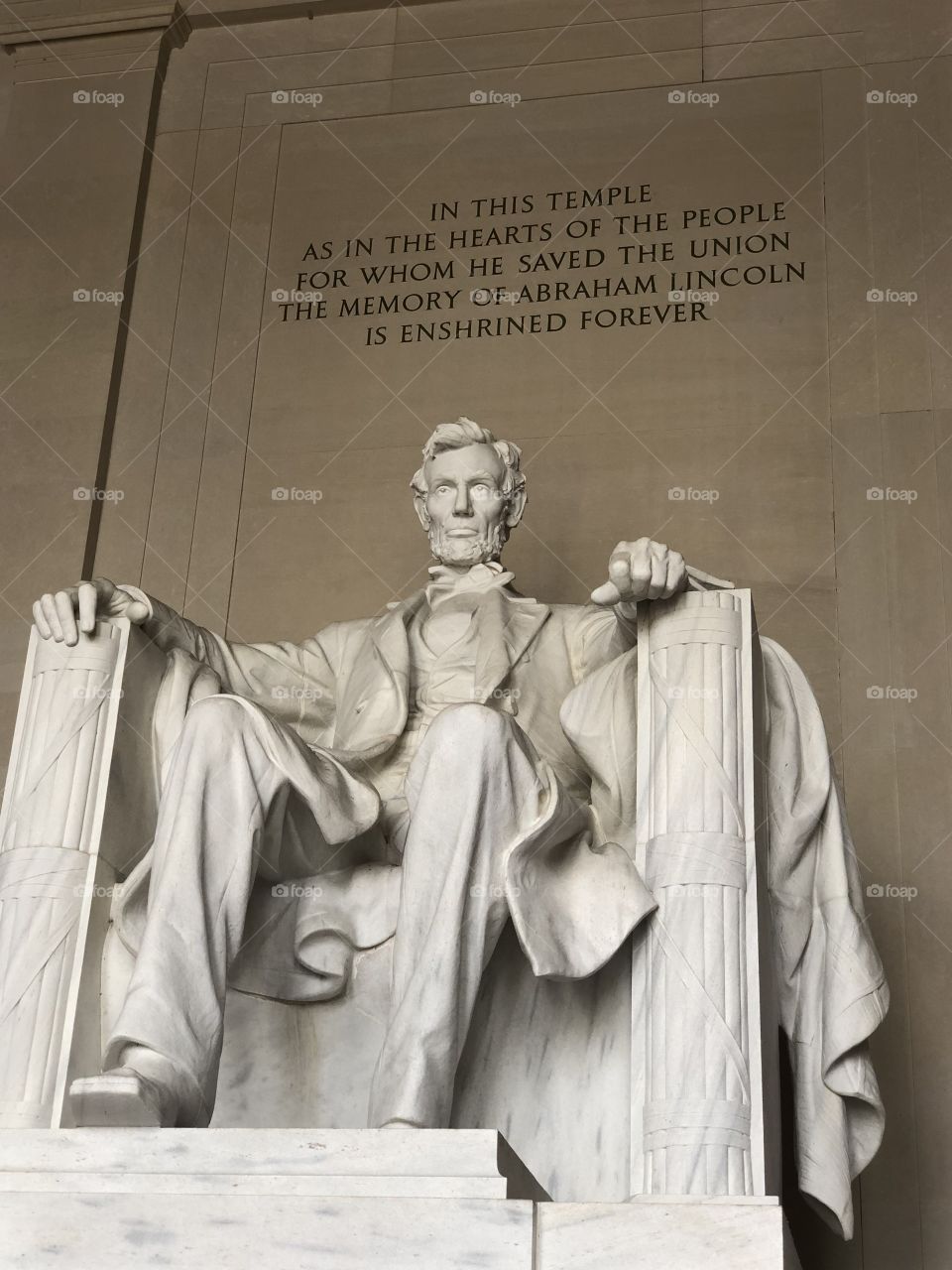 Statue of Abraham Lincoln with a quote above him in the Lincoln Memorial in Washington, D.C.