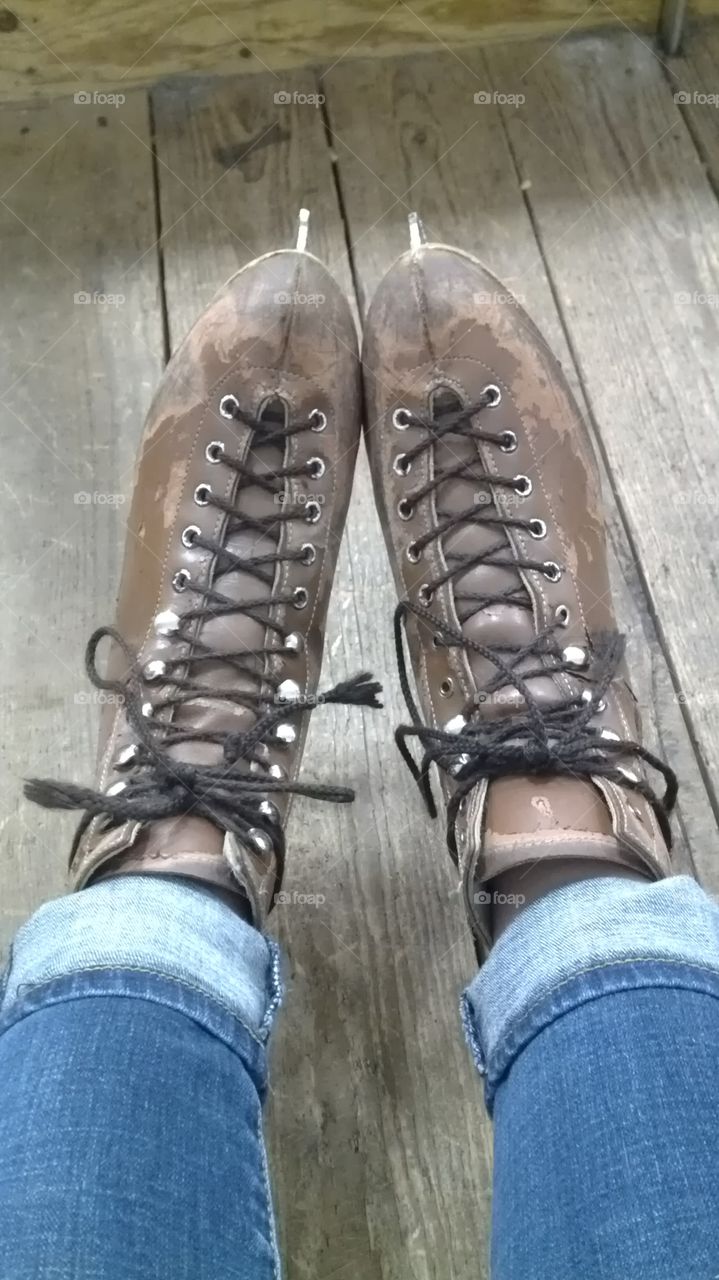 Old ice skates and jeans