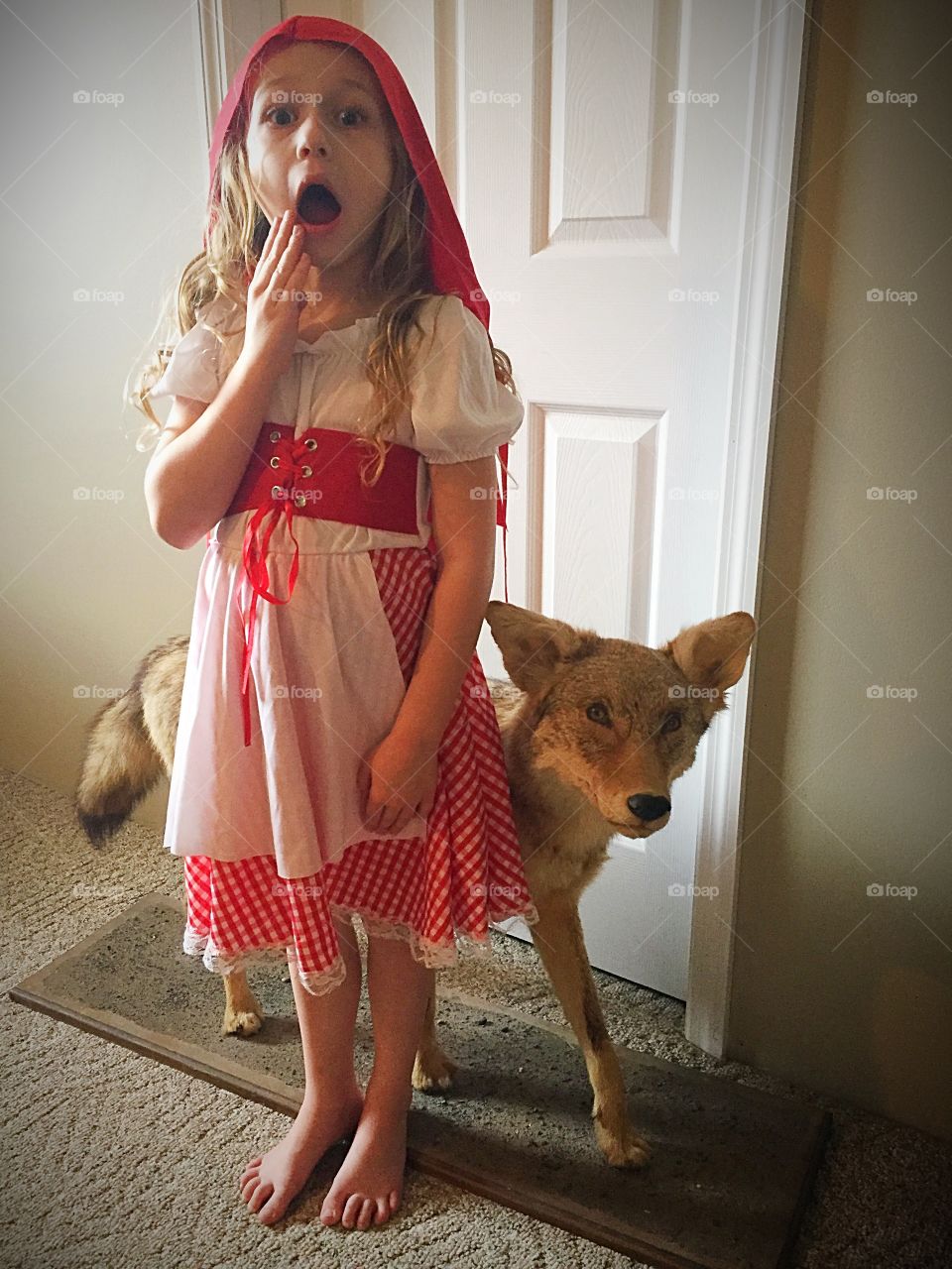Surprised girl standing with dog