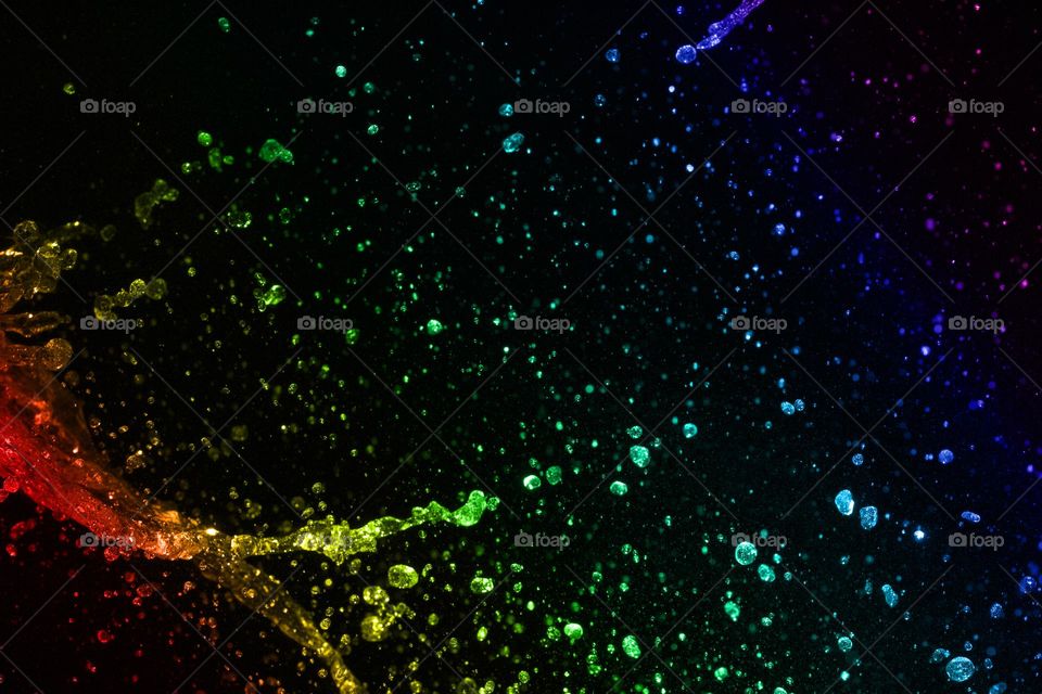 multicolored water splash on black background.  abstract background