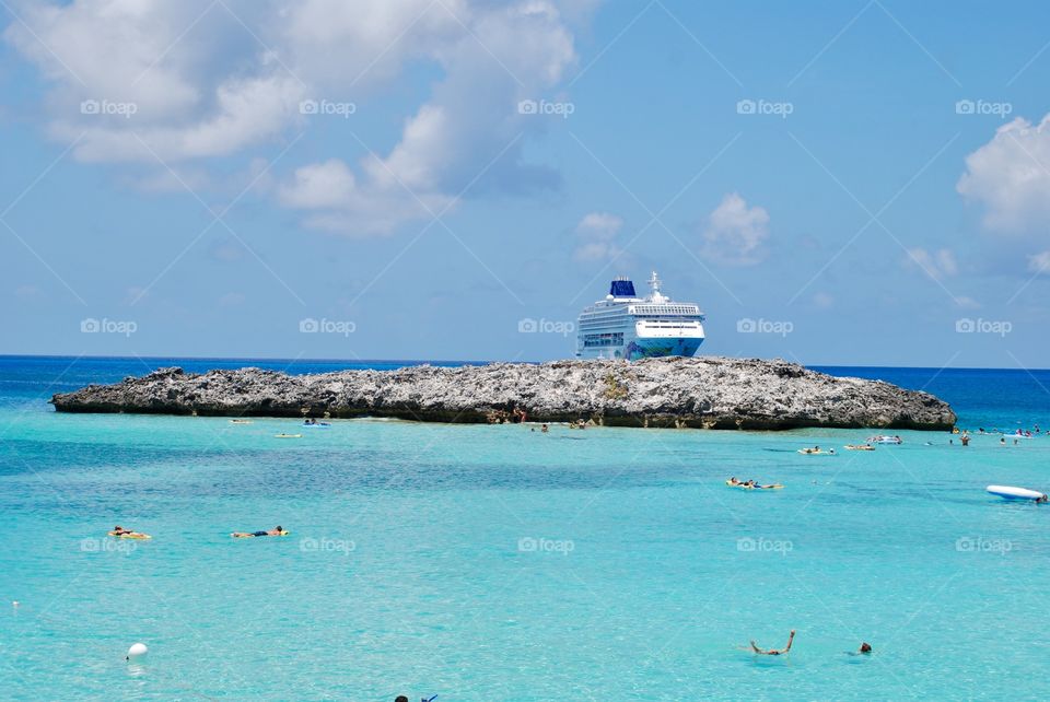 Swimming in the Caribbean with cruise ship in background 