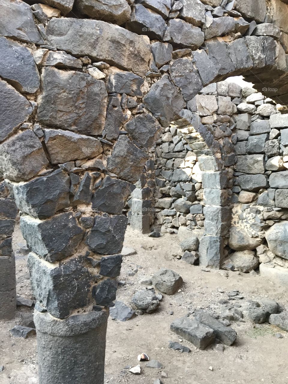 Inside the ruins of an ancient house in Korazin, Israel. They were famous for their archways inside their houses. 