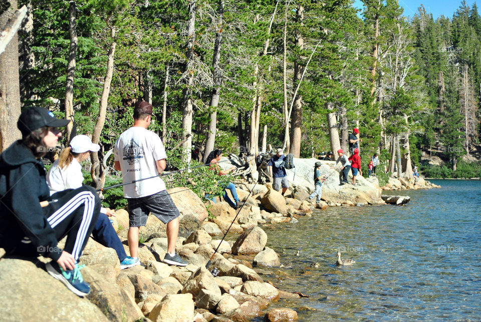 People fishing at the lake