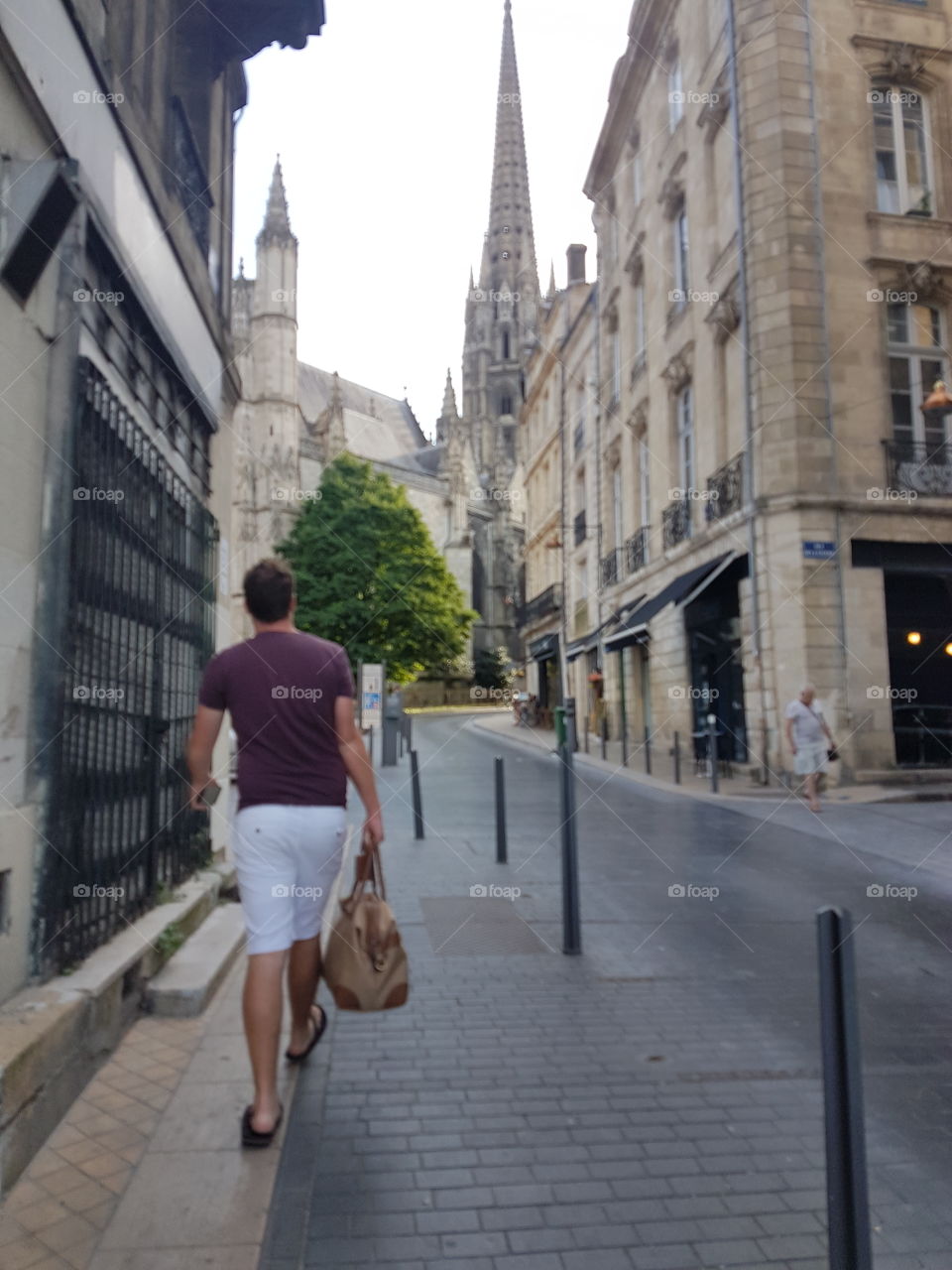 man carrying luxury bag in Bordeaux, France.