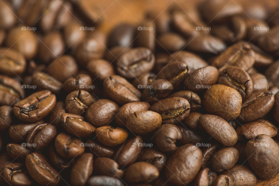 Brown coffee beans, closeup of macro coffee beans for background and texture