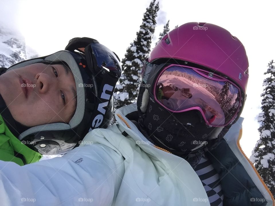Snowboarding, snowboarder, pink, pink helmet, goggles, ski, ski jacket, arcteryx, ski jacket, reflection, pink lady, winter, snow, snowing, ski resort, portrait, selfie, sun