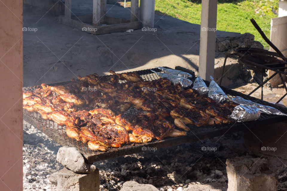 World famous Boston Bay jerk chicken cooking in the barbeque grill in Boston Bay in the East Coast of Jamaica on 30 December 2013.