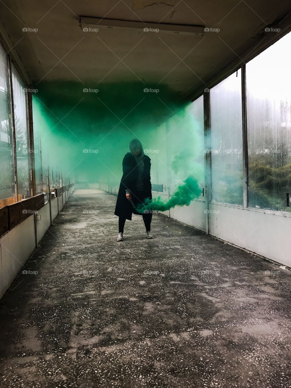 A person holding smoke bomb