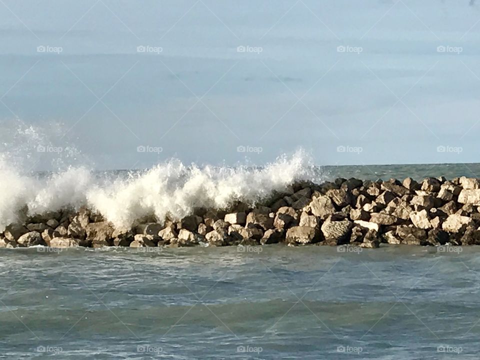 Waves over rocks 