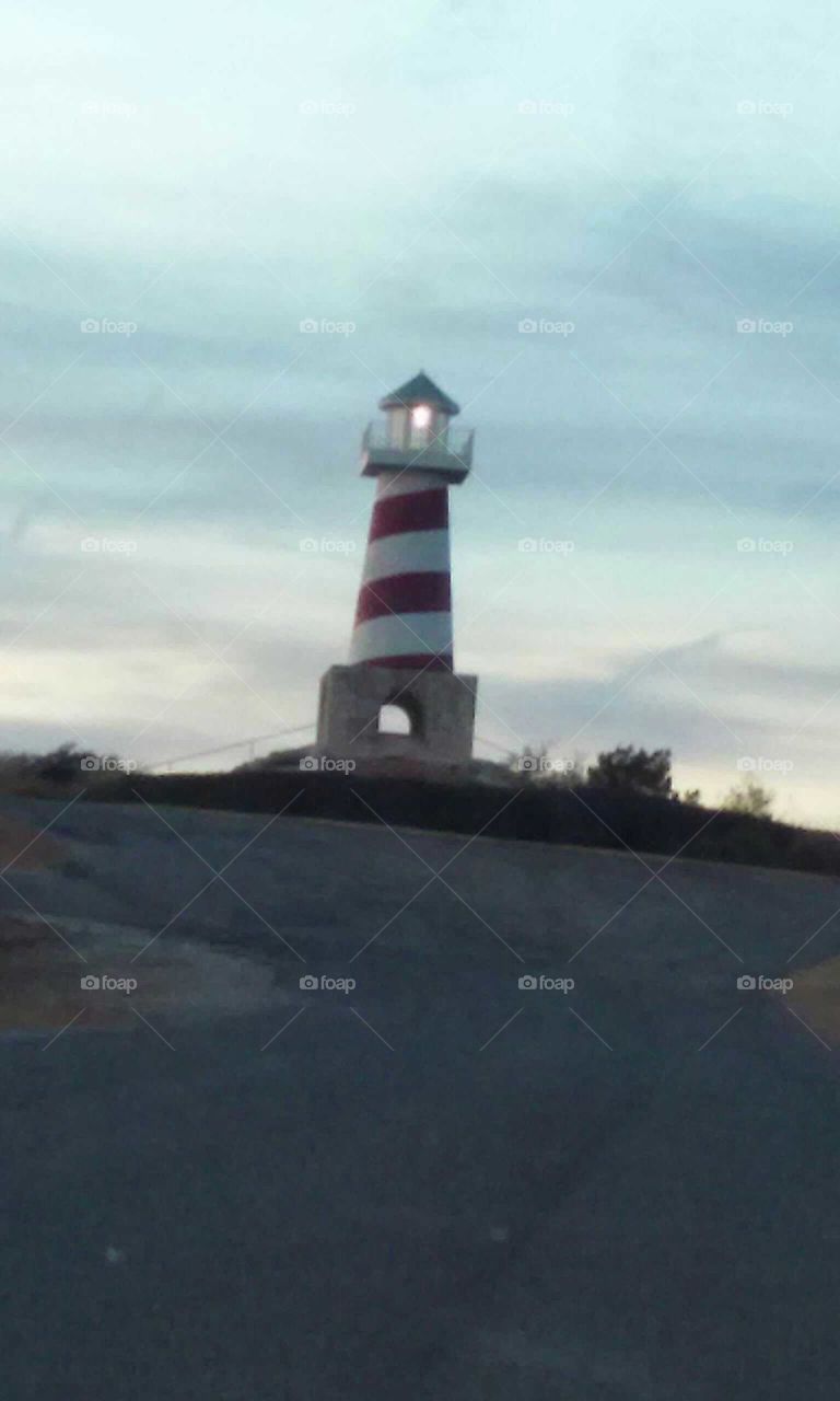 Embracing the majestic beauty of an iconic lighthouse at sunset in Texas