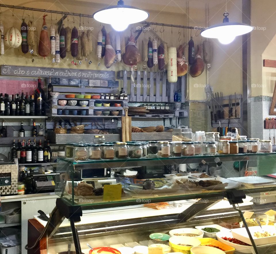 Old school deli in Siena, Italy. Delicious appetizers, meats, prosciutto, cheeses, breads, olives, wine. 