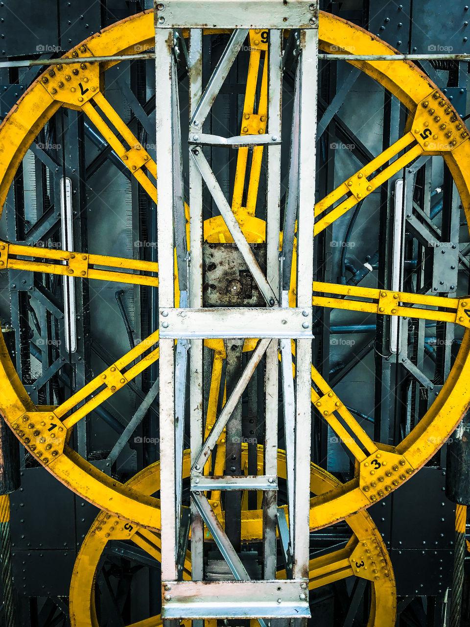 Huge metal cogs and machinery that drive a cable car on a funicular in Barcelona 