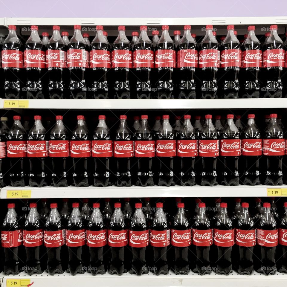 Coca Cola. Products on rack.