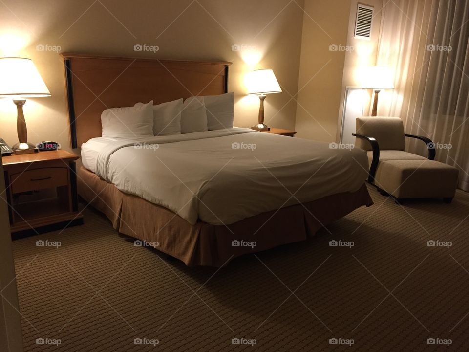 A cozy motel room bed