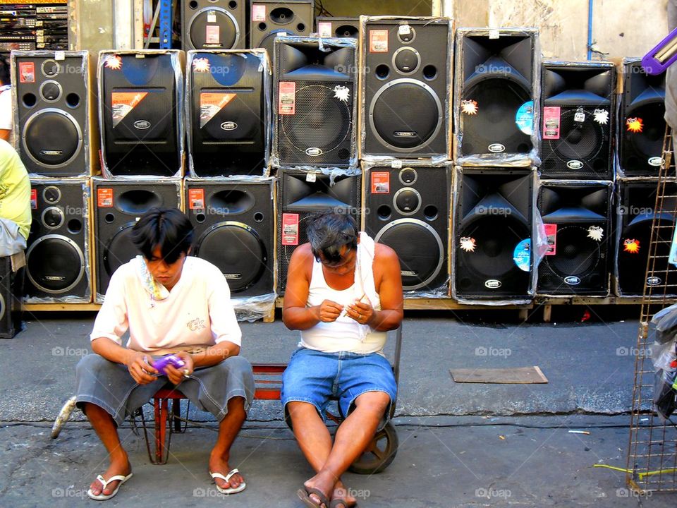 asian street vendor selling stereo speakers in quiapo, manila, philippines in asia