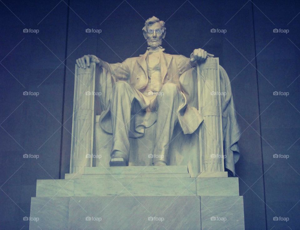 This image shows the statue of Abraham Lincoln at the Lincoln Memorial in Washington, D.C. This iconic monument honors the 16th President of the United States and is a symbol of American heritage. 