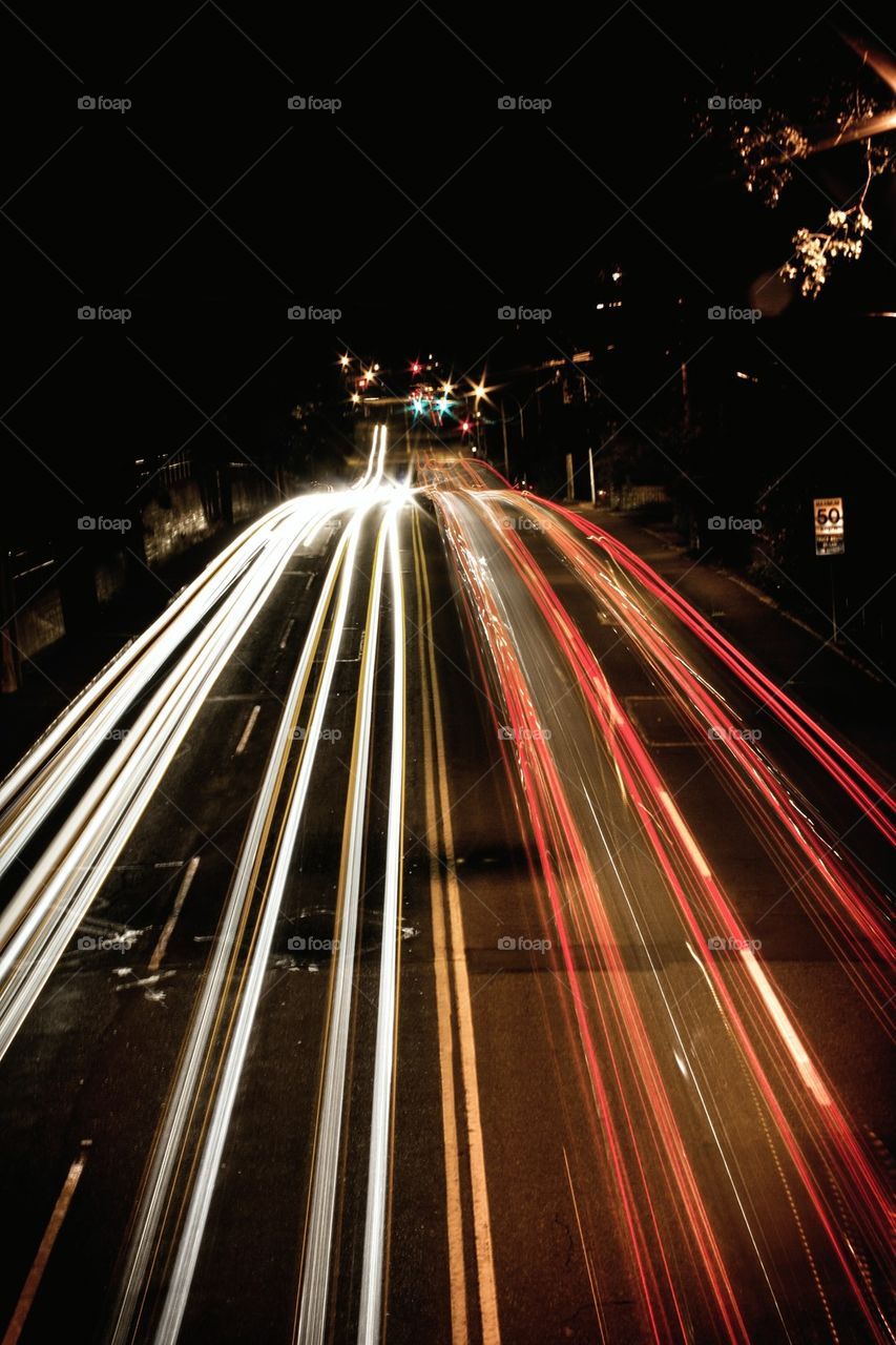 Vehicle lights streaking on highway at night