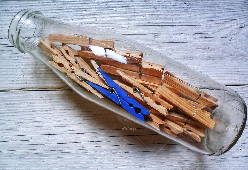 clothespins are in a milk bottle