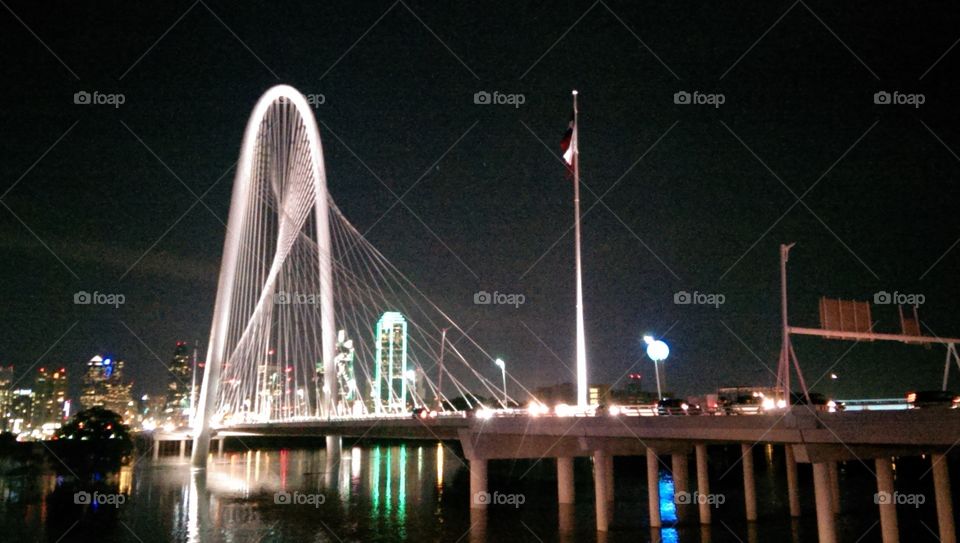 Dallas at night. Margaret Hunt Hill Bridge, Dallas, TX during flooding of Trinity river