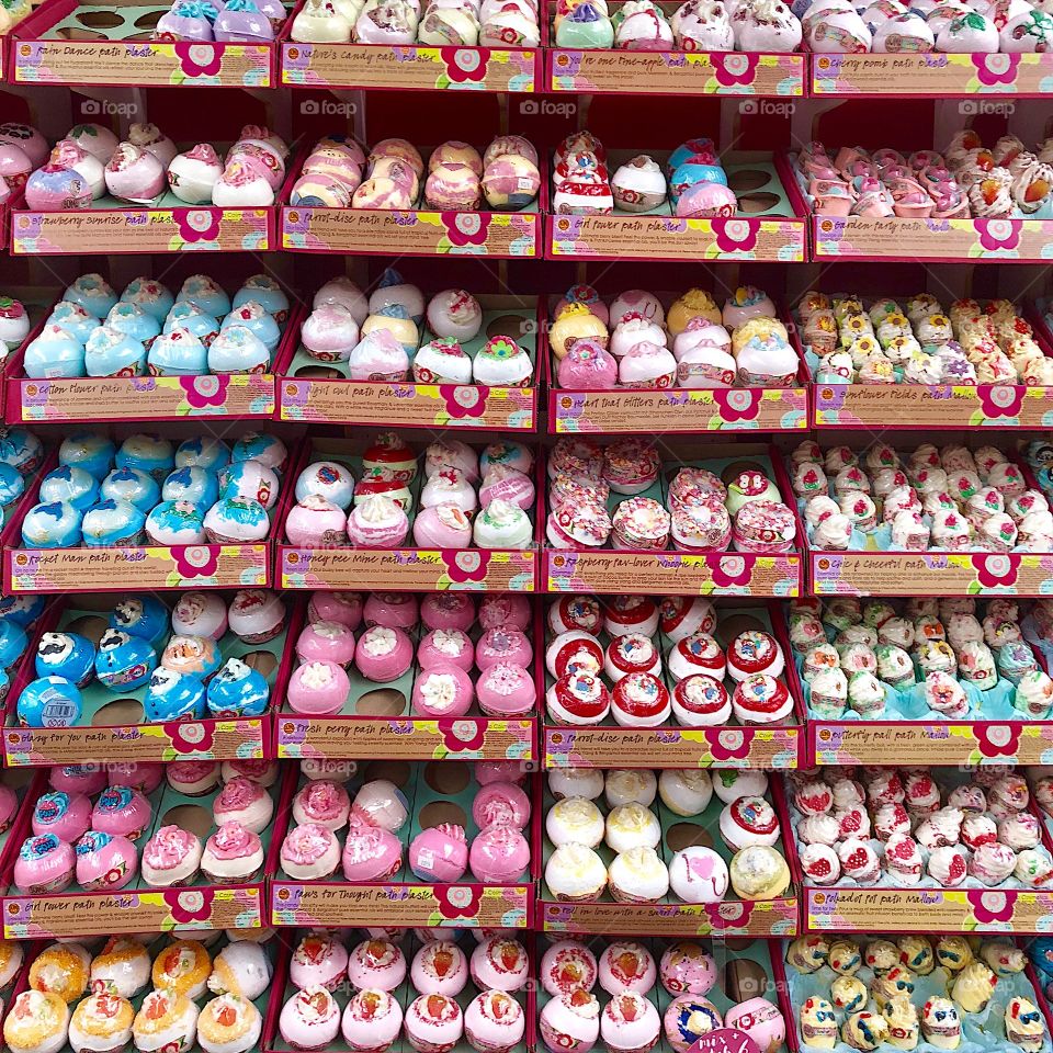 Colorful selection of bath bombs in a shop store 