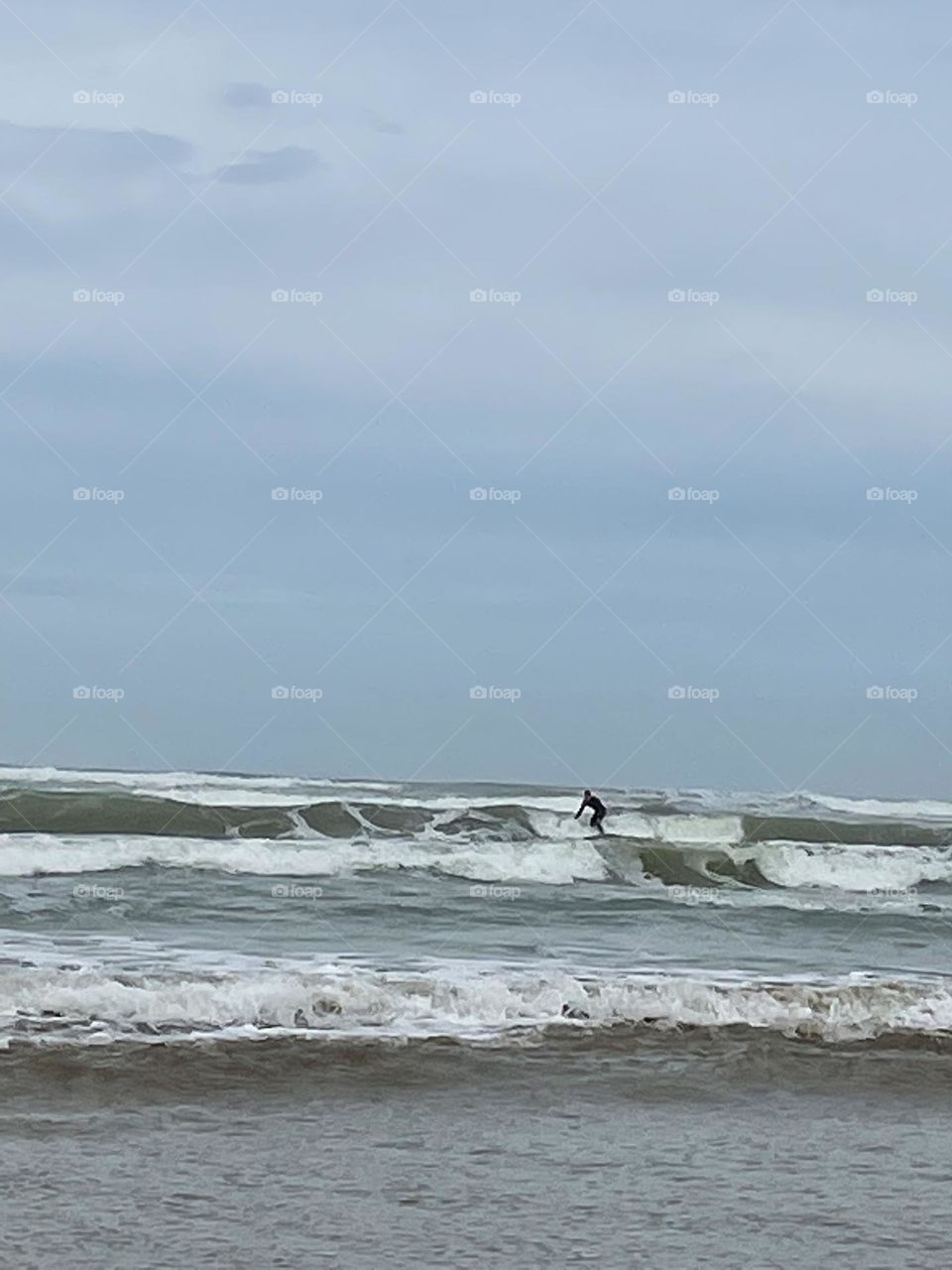 A person surfing on a wave 