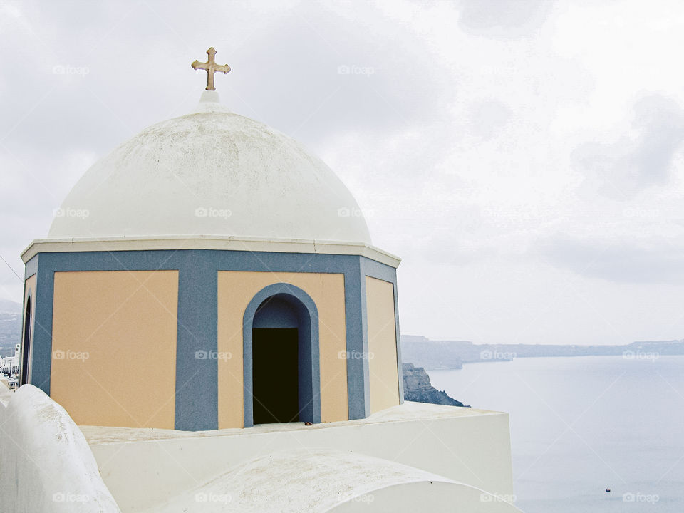 Blue & yellow church with dome roof, Santorini Greece 