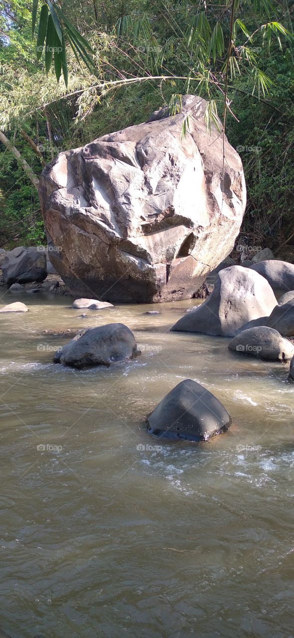The big rock in the middle of the river