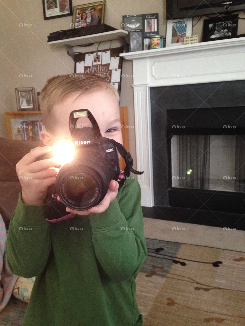 Boy looking through camera