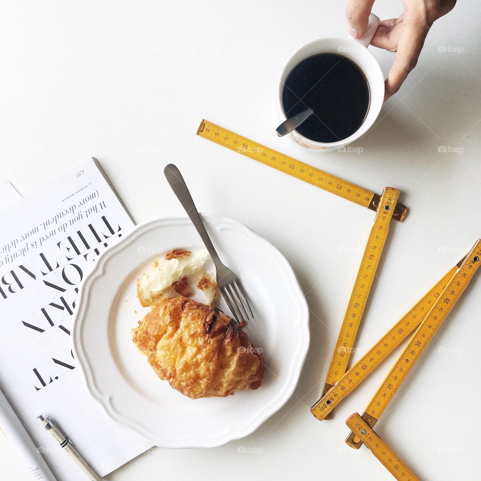 Breakfast with cheese croissant and coffee.