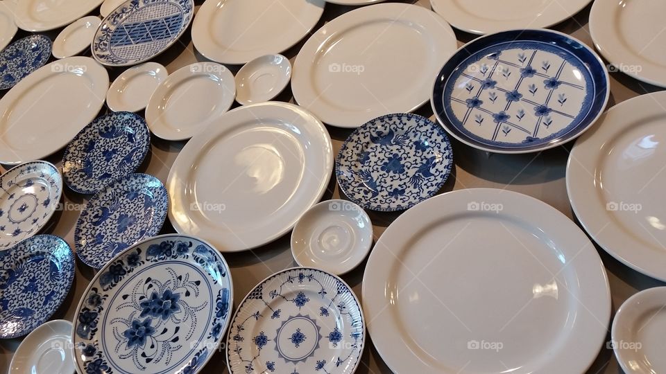 Lots of plates. Blue and white plates