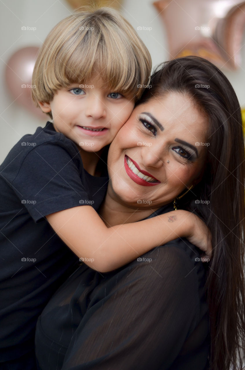 mother and son holding each other smiling happiness and love in a photo
