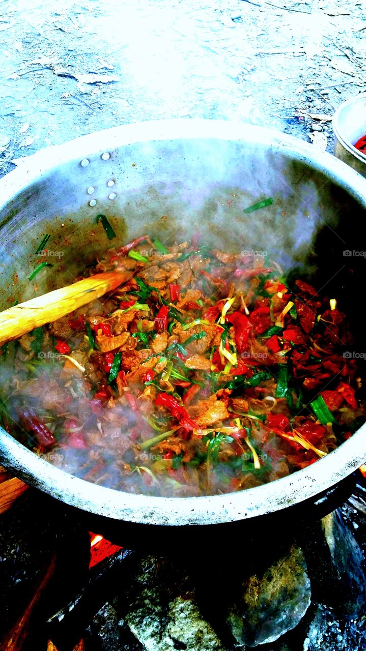 one thing that makes travelling memorable is the food that we get to taste in different places. beef chilli cooked with Bhutanese receipe in an open air for group of travellers in Bhutan to give them the true taste of Bhutanese dish.