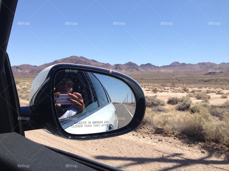 Rearview mirror and the desert. Rearview mirror and the desert