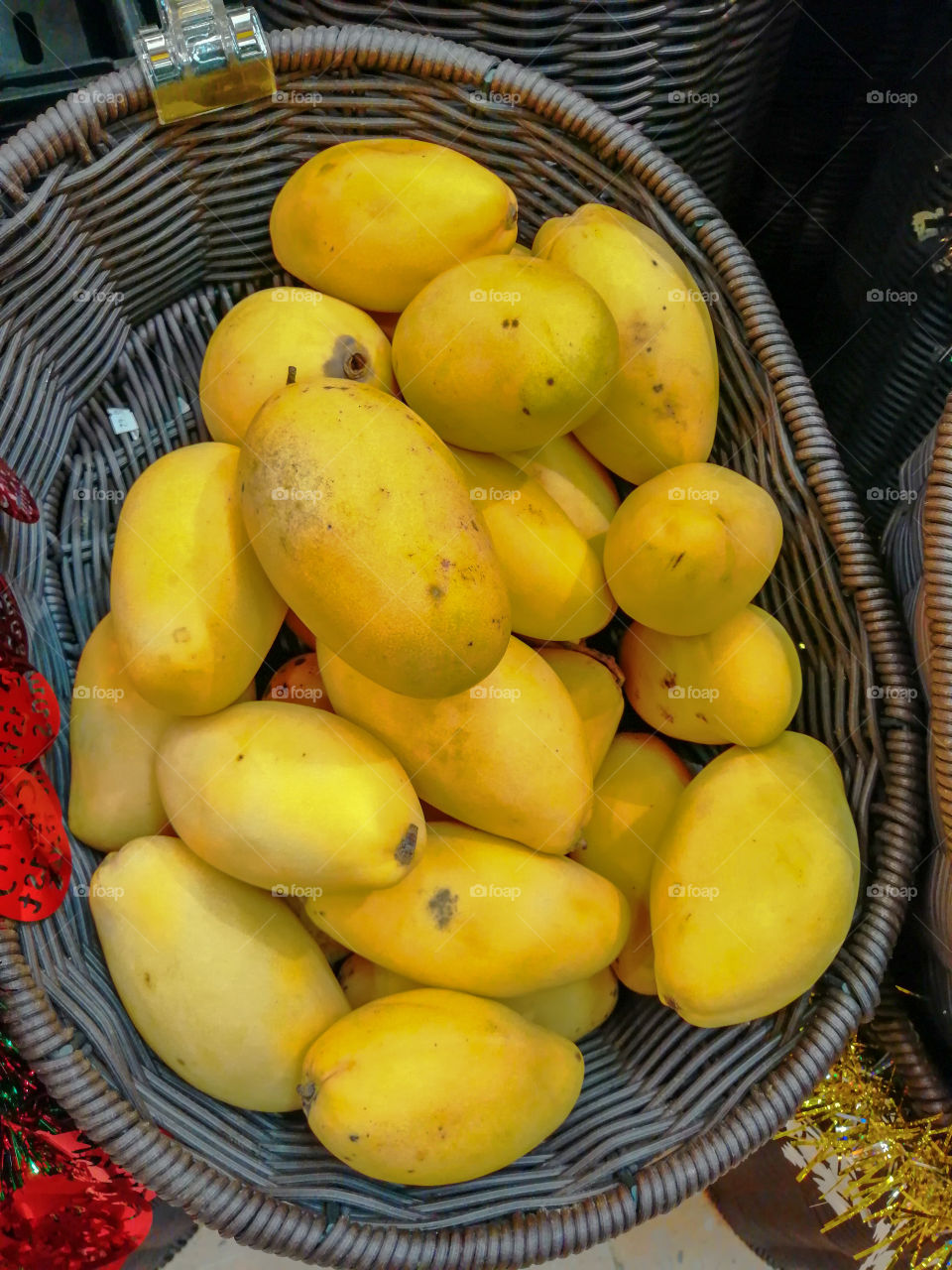 Yellow mangoes in a basket