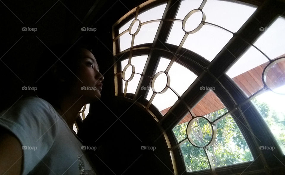 Lonely and seeing ourside like try to escape from something on blue day but it actually just relex inside the house haaaa.