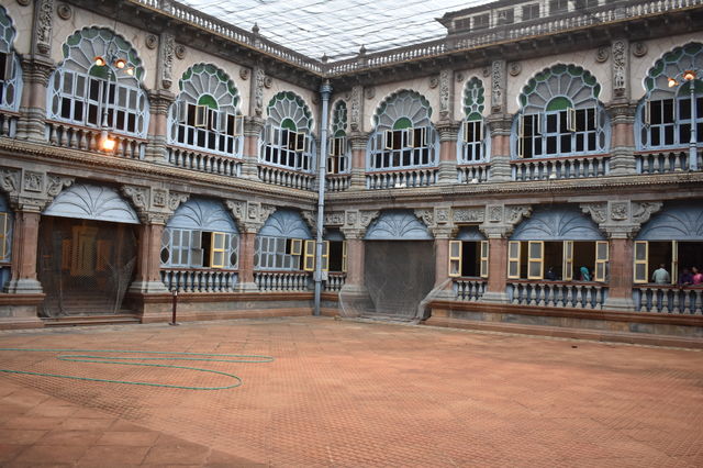 playing area inside palace with building surrounding