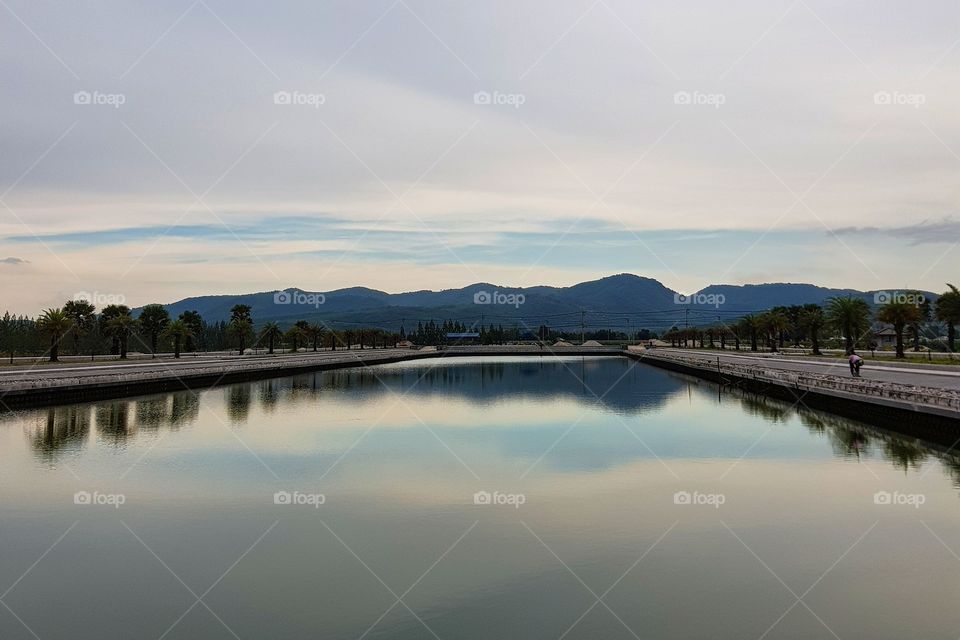 Scenic view of pool against blue sky