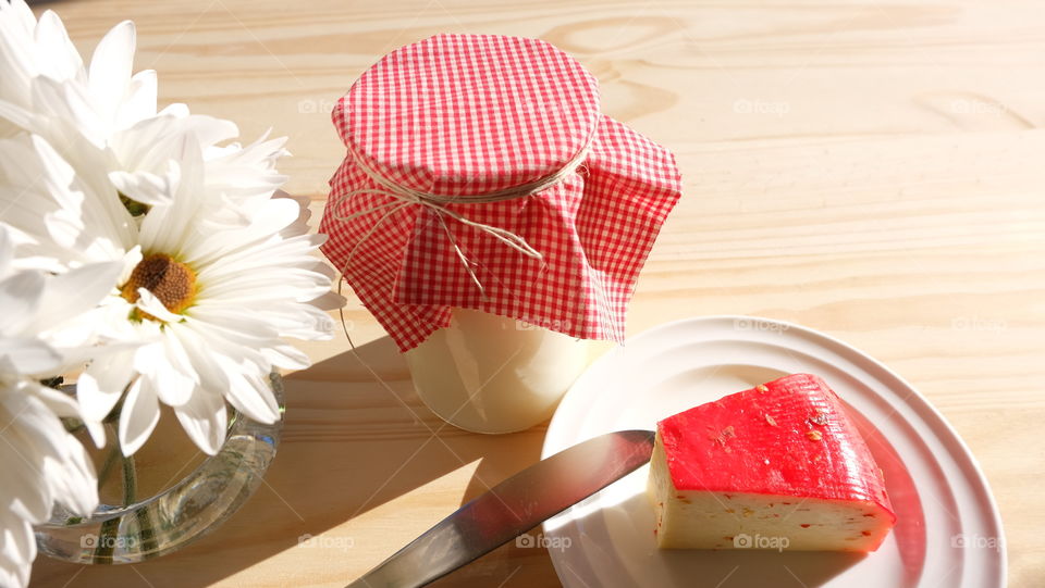 Milk and cheese on table