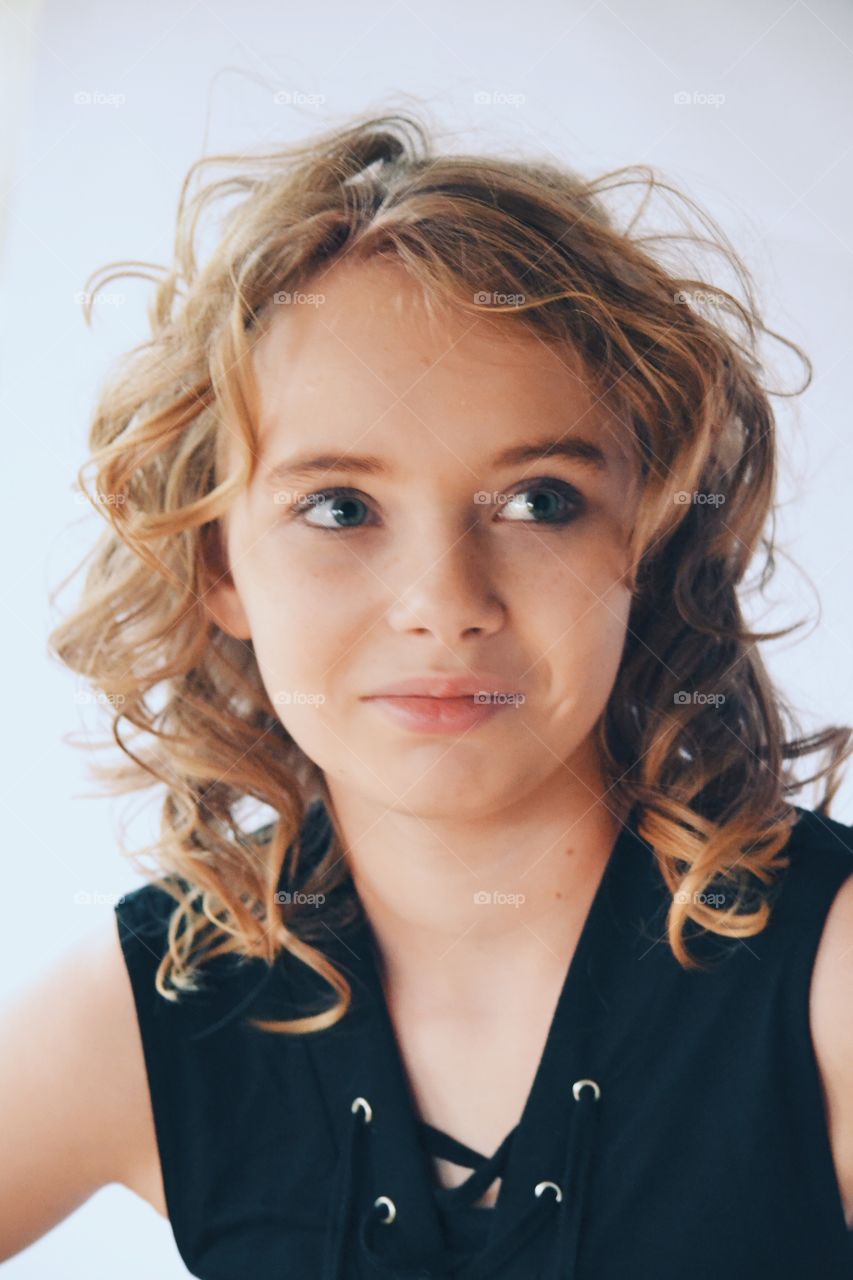 Smiling girl in curly hair