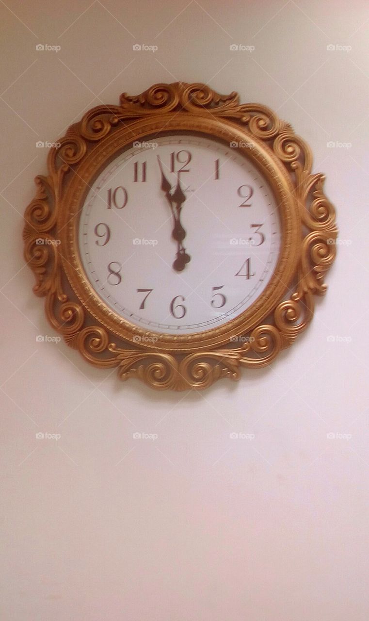 Clock with antique golden frame