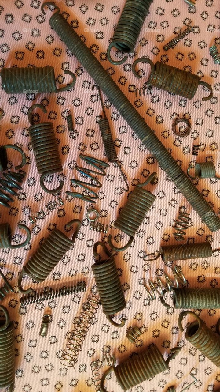 Rusty Springs On A Pink Background